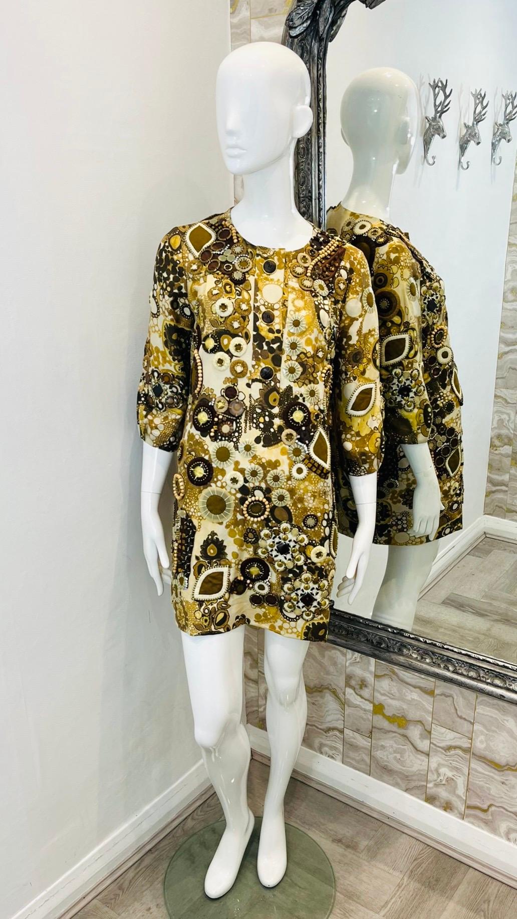 Chloe Bead Embellished Silk Dress

Brown printed dress designed with decorative beads, sequins and crystal adornments throughout.

Featuring round neckline detailed with tripe button accent.

Styled with three-quarter sleeves and loose-fit