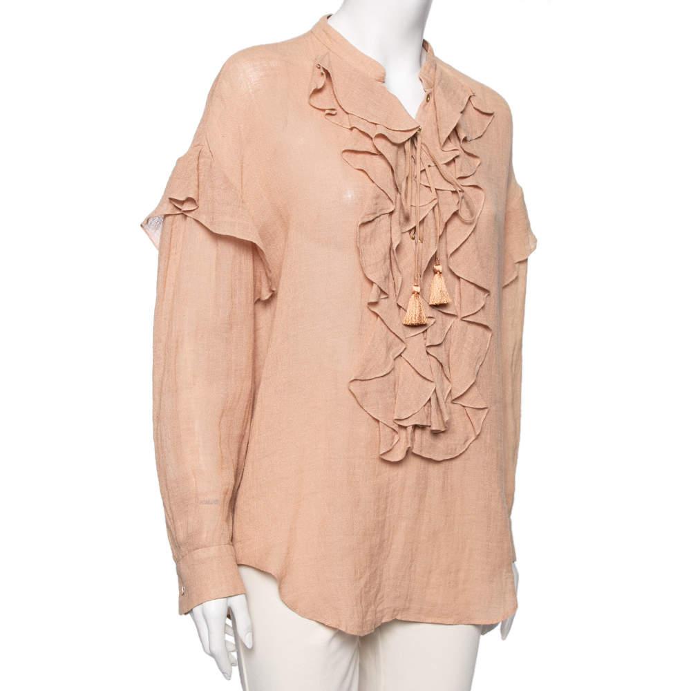 Be it for a formal or informal event; this Chloe blouse is apt for every occasion! Designed from cotton, it has a lace-up ruffle on the front, long sleeves with a button on the cuff, and a mandarin collar. Complete the look with black skirts or
