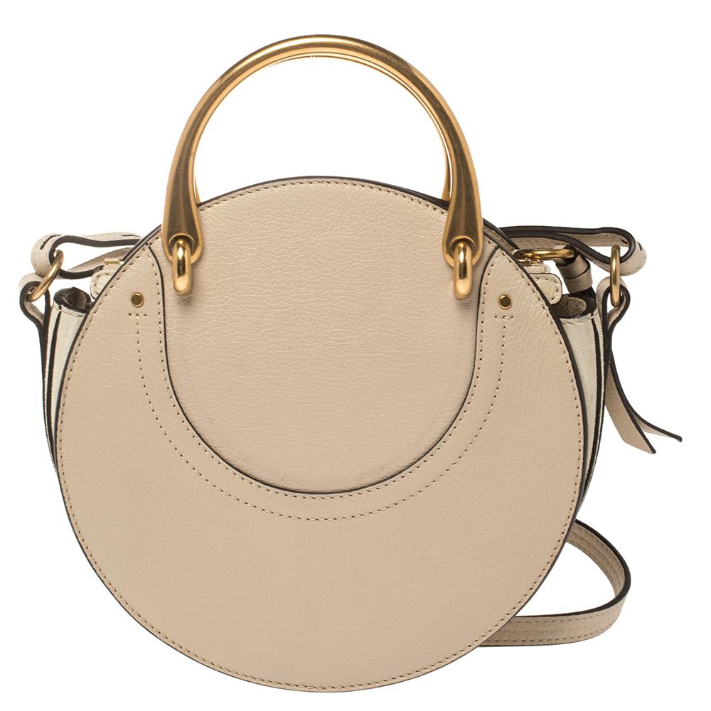 Give your totes and hobos a rest and opt for a light accessory when you're heading out with your friends or family, like this Pixie bag from Chloe! The leather and suede bag is cute and versatile in design. It flaunts a round shape and it is held by