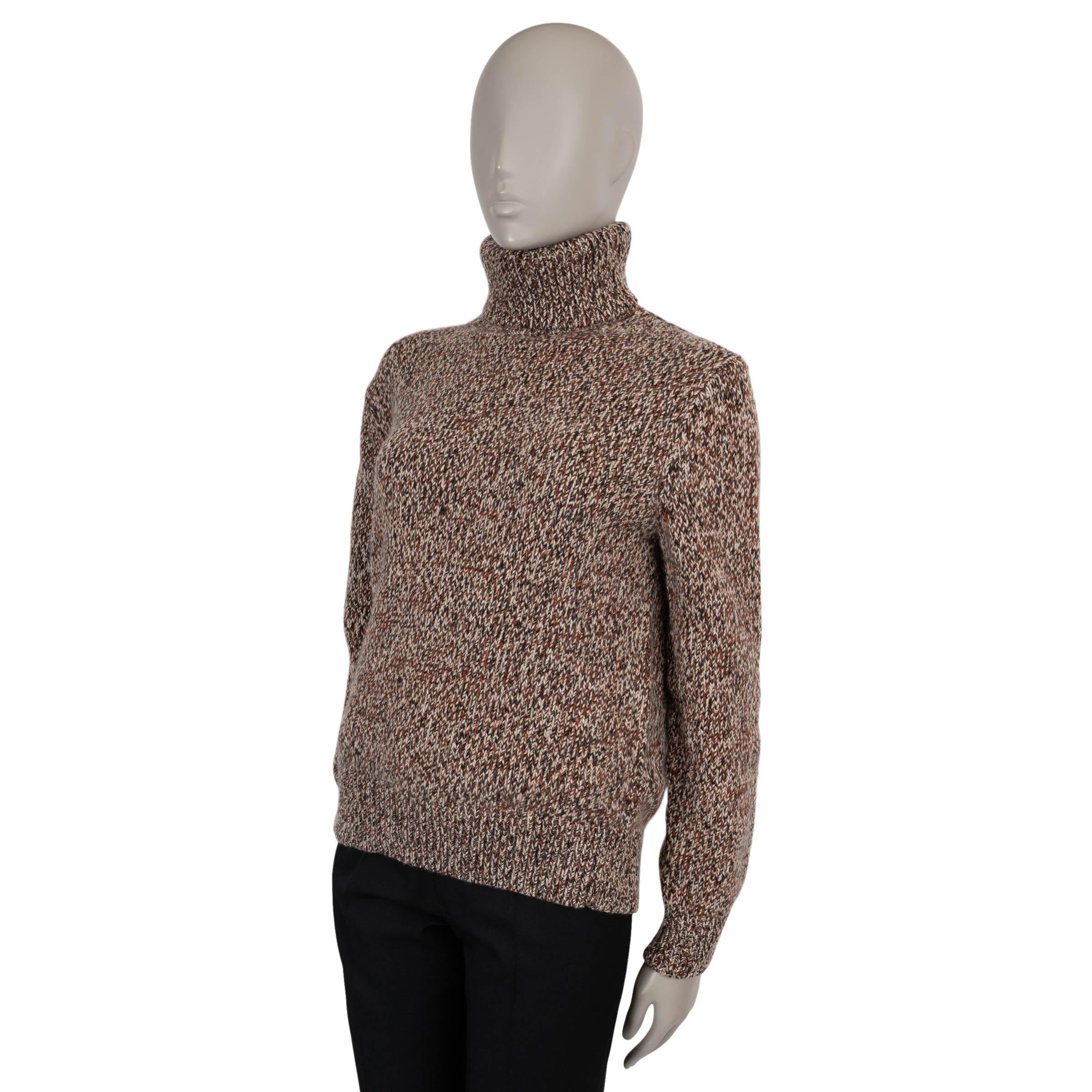Ce pull 100% authentique Chloé en cachemire (69%) et laine (31%) mélangés rouille, marron et beige incarne la sophistication sans effort. Conçu avec une coupe classique, il présente un col roulé douillet et des finitions en tricot côtelé pour une