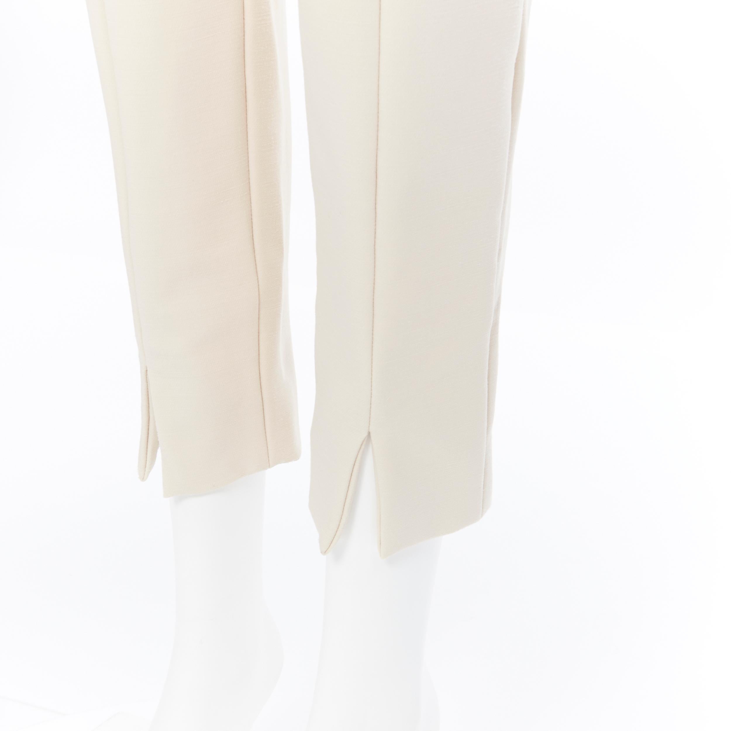 CHLOE beige nude virgin wool blend slim fit slit hem trousers pants FR40
Brand: Chloe
Model Name / Style: Cropped pants
Material: Wool blend
Color: Beige
Pattern: Solid
Closure: Zip
Extra Detail: Concealed zipper closure slit pocket. Slit detail at