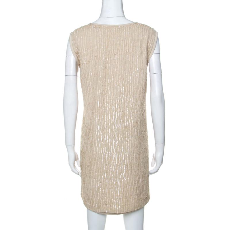 Make a unique style statement wearing this ravishing dress from the house of Chloe. Wear this shimmery number with your favorite accessories for a glamorous yet edgy look. Ladylike, this dress is crafted from silk and is adorned beautifully with