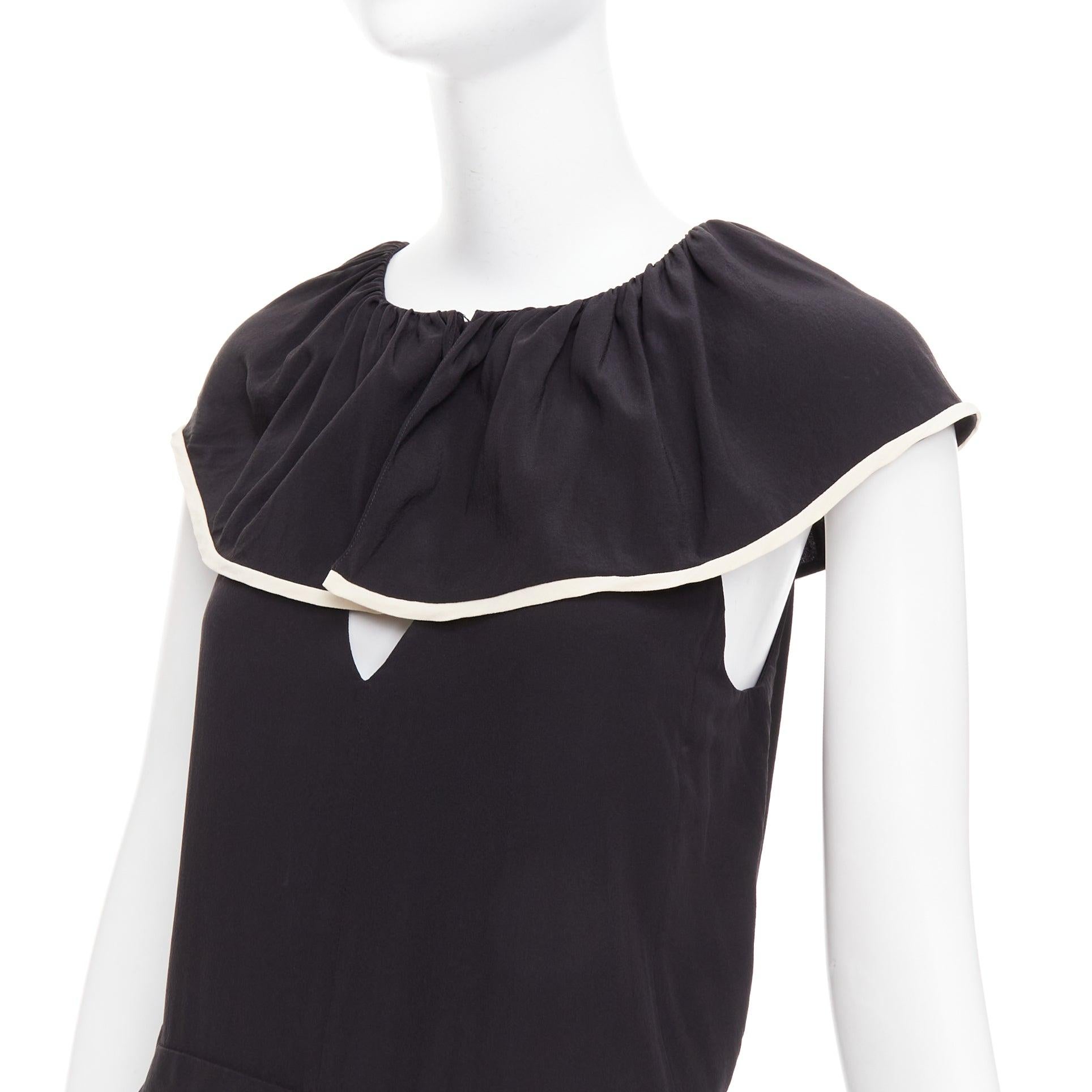 CHLOE tuta nera in crepe de chine 100% seta con collo a balze FR36 S
Riferimento: GEGG/A00161
Marchio: Chloe
Materiale: Seta
Colore: Nero, Bianco
Modello: Tinta unita
Chiusura: zip
Fodera: Seta nera
Dettagli extra: la sua tuta sposa una silhouette a