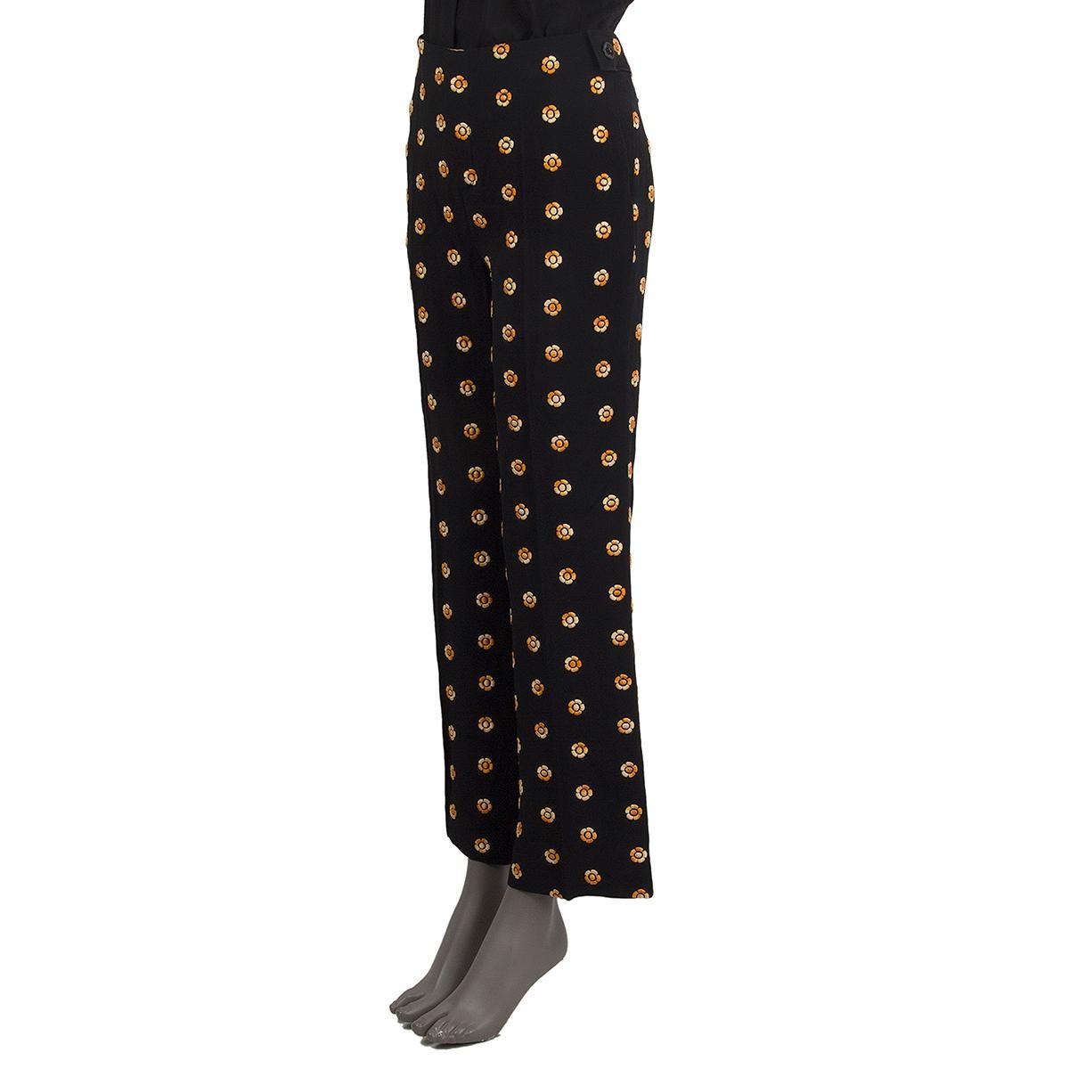 100% authentic Chloé flower embroidered pants in black and yellow acetate (53%) and viscose (47%) with pockets. Close on the front with a zipper and hook fasteners. Partially lined in acetate (70%) and silk (30%). Have been worn and are in excellent