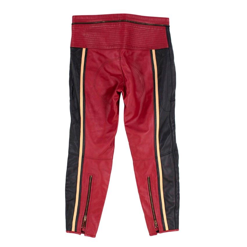 Chloe Black and Burgundy Motorcycle Pants
 

 - Burgundy and Black leather trousers with biker style detailing including knee patches, back ankle zip, and directional stitch work on the back hip
 - Contrasting cream leather stripe running down the