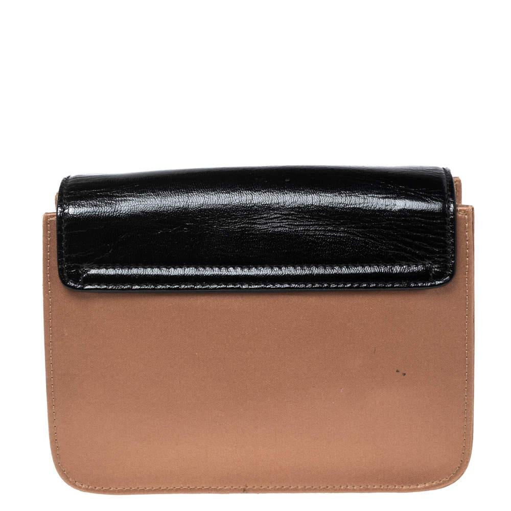 This stylish Sally shoulder bag from Chloe is crafted from black/beige leather and gold-tone metal. The bag features a shoulder chain and a flip-lock on the flap. This Sally is added with a satin-lined interior.

Includes: Authenticity Card, Info