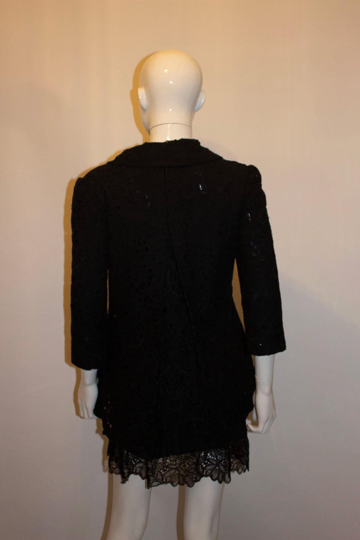 A pretty black broderie anglaise jacket by Chloe, See By range. The jacket has a pleat detail at the back , elbow length sleaves, and a five button fastening. The jacket is lined.  Size S
Measurements: Bust up to 36'', length 27''
