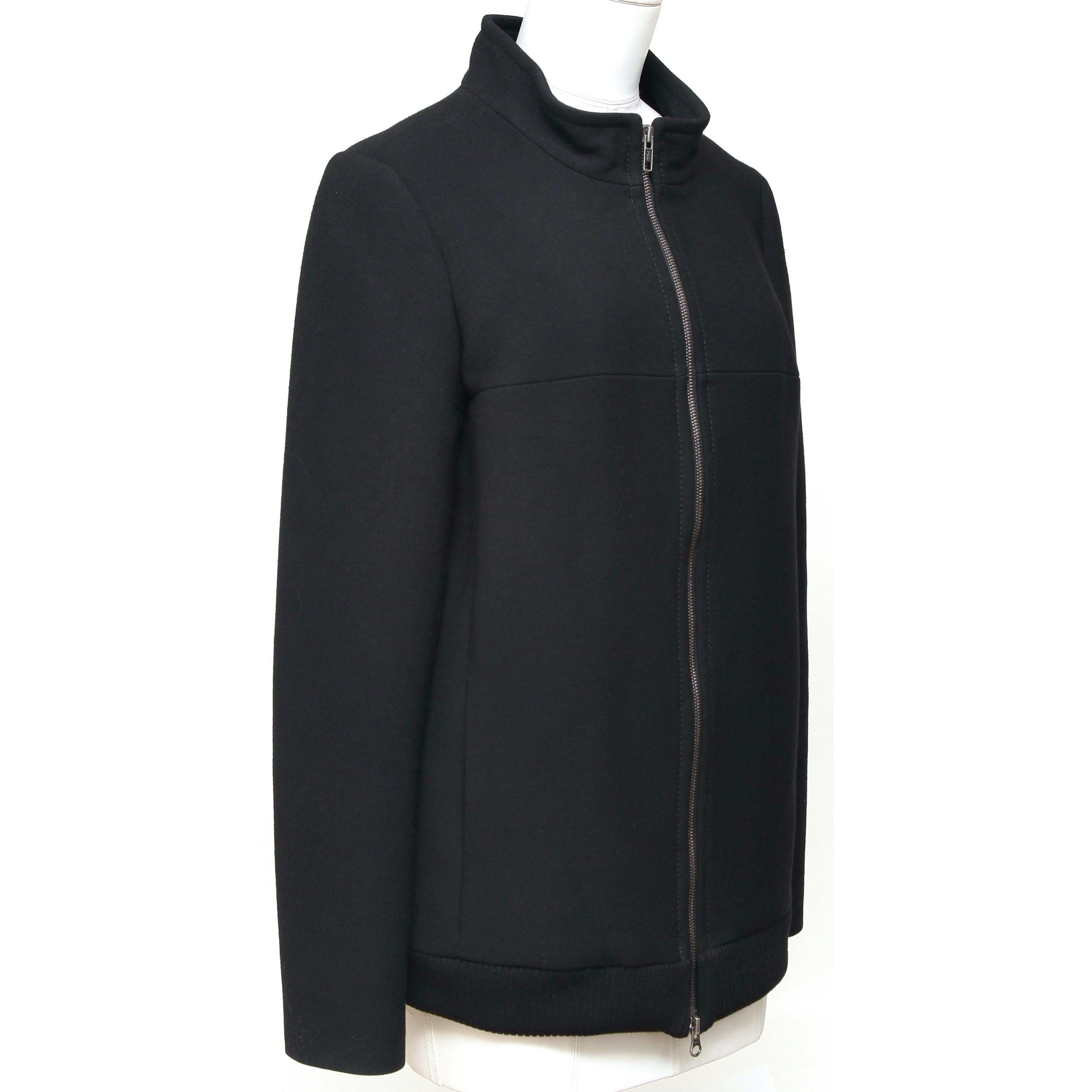 GUARANTEED AUTHENTIC CHLOE 2007 BLACK LONG SLEEVE JACKET

Design:
• Basic jacket in a black color.
• Stand-up collar.
• Dual front vertical slip pockets.
• Long sleeve.
• Front two way zipper closure.

Material: Viscose, Wool

Size: 36

Measurements