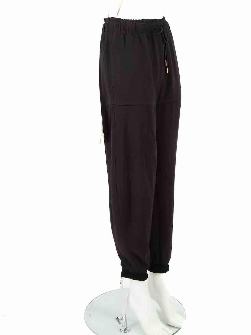 CONDITION is Very good. Minimal wear to trousers is evident. Minimal wear to right side pocket seam where stitching has become undone on this used Chloé designer resale item.
 
 Details
 Black
 Synthetic
 Trousers
 Tapered fit
 Elasticated waistband