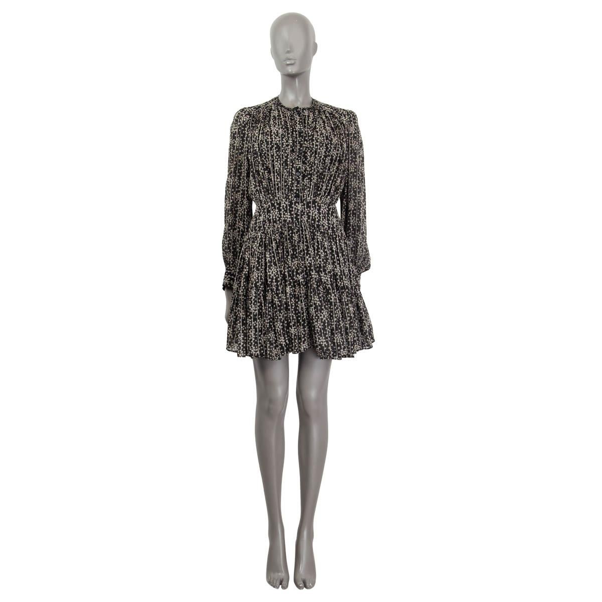 100% authentic Chloé floral print mini dress in black and white silk georgette (100%). Features a crew-neck and buttoned cuffs. Has long sleeves and is gathered at the waist. Opens with five buttons at the front and a concealed zipper at the side.
