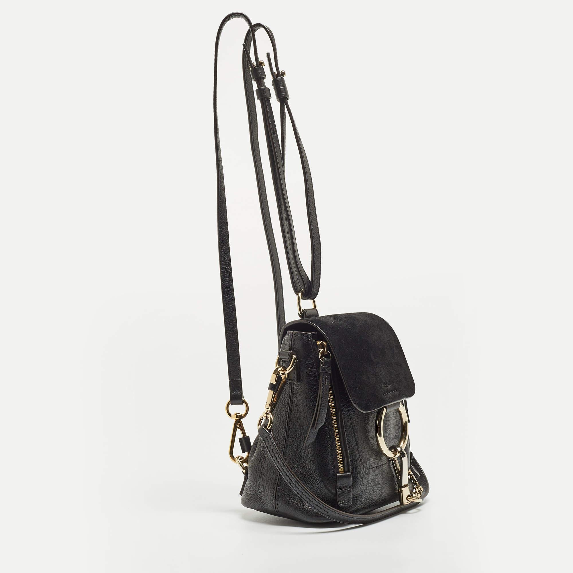 You are going to love owning this Faye Day backpack from Chloe as it is well-made and brimming with luxury. The bag has been crafted from leather and designed with a suede flap that comes with the signature ring and chain in gold-tone metal. It