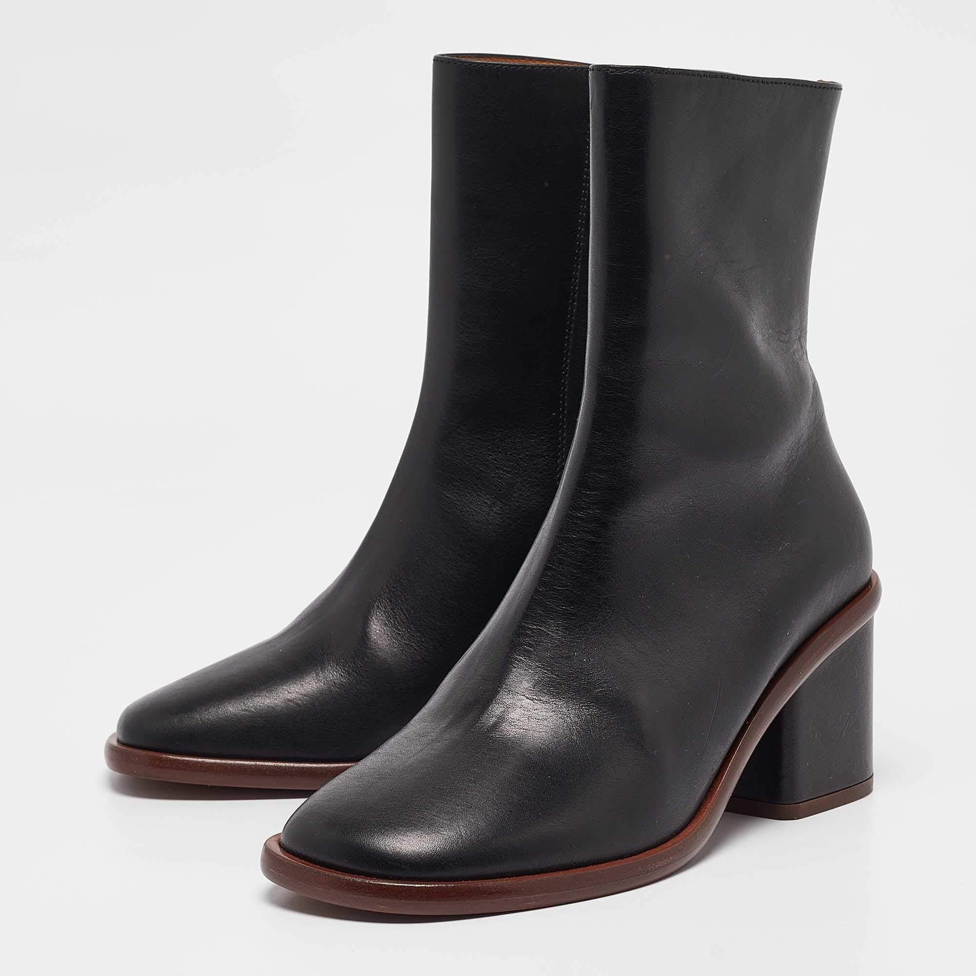 Youll find these Chloe black leather ankle boots a reliable style companion. The classic shape clean details and block heels make them perfect for fall and beyond.