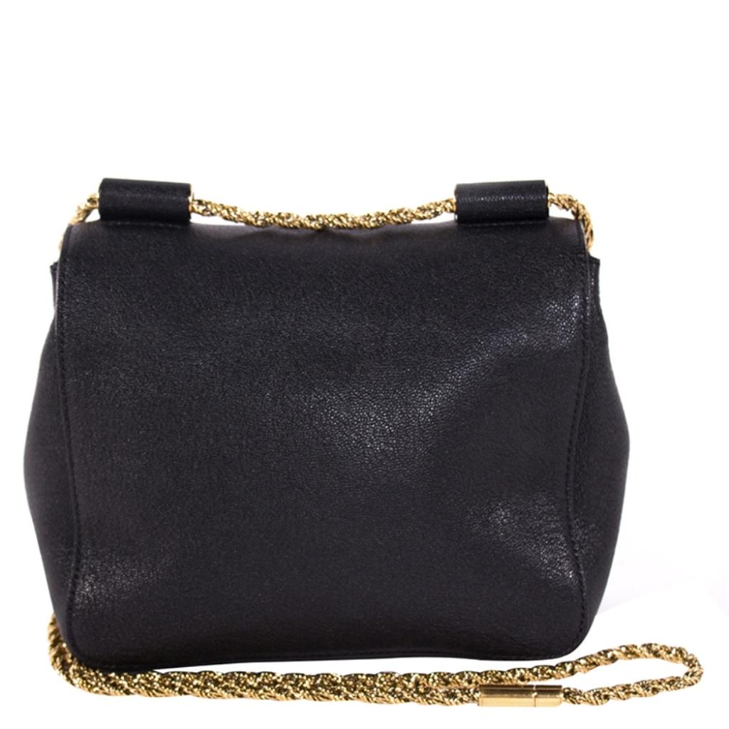 Crafted using leather this Chloe bag is aesthetically elegant. The use of gold-tone hardware in the chain strap and at the front is enough to augment the oomph factor. The front flap is secured with turn lock closure and the interiors are lined with