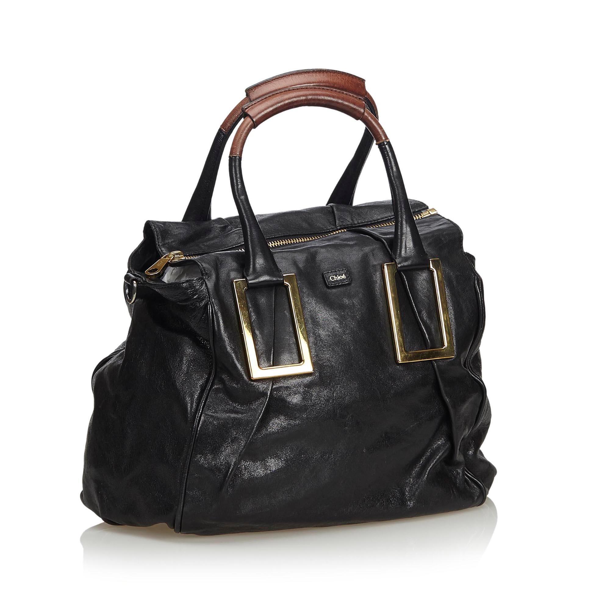 The Ethel features a leather body, rolled handles, gold-tone hardware, a top zip closure, and an interior zip pocket. It carries as B+ condition rating.

Inclusions: 
This item does not come with inclusions.

Dimensions:
Length: 25.00 cm
Width: