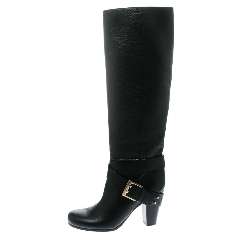 These knee-high boots from Chloe spell nothing but chic and are worth every penny you spend! The black boots are crafted from leather and feature round toes. They have been styled with a gold-tone buckle strap and come equipped with comfortable