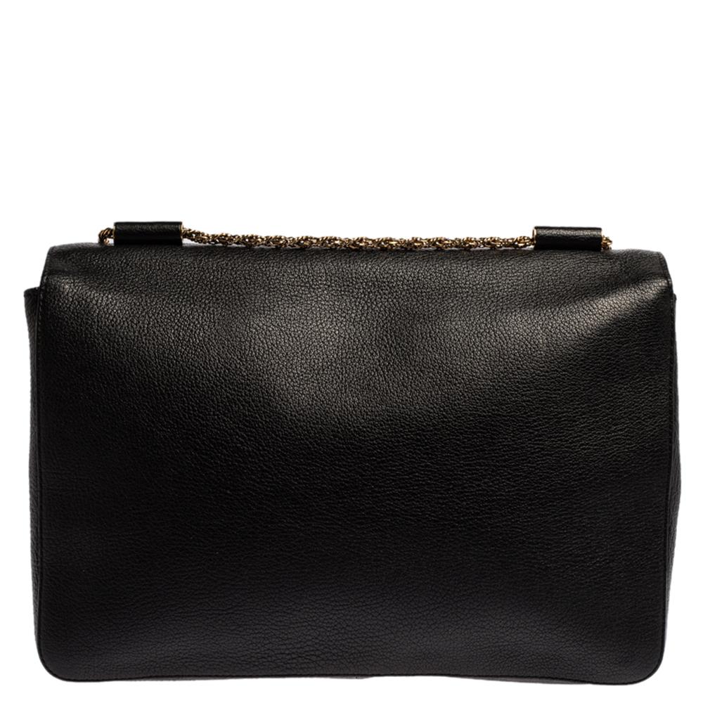 Every curve and detail on this Chloe Elsie is grand which adds to the worth of the bag. It has been crafted from black leather and styled with a front flap. The bag is secured by a gold-tone twist-lock revealing a well-sized leather interior and