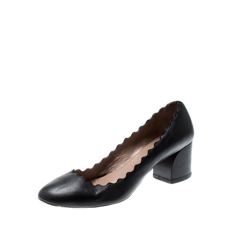 These black Lauren pumps from Chloe are sure to fetch you admiring glances every time you step out in them! They have been crafted from leather and styled with round toes and scalloped trim detailing that looks amazing. They come equipped with