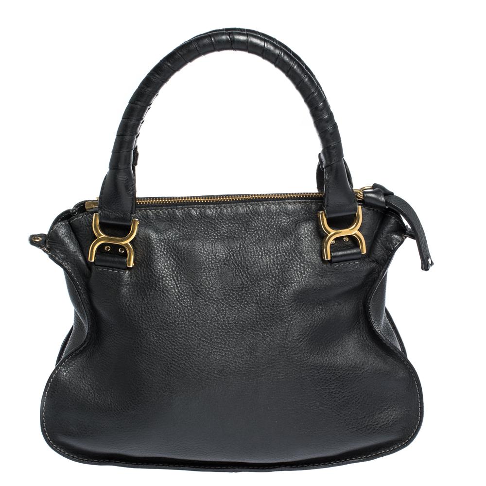 Stunning to look at and durable enough to accompany you wherever you go, this Chloe satchel is a joy to own! This Marcie bag is crafted from leather with dual handles and a well-designed front exterior enhanced with stitch detailings and gold-tone