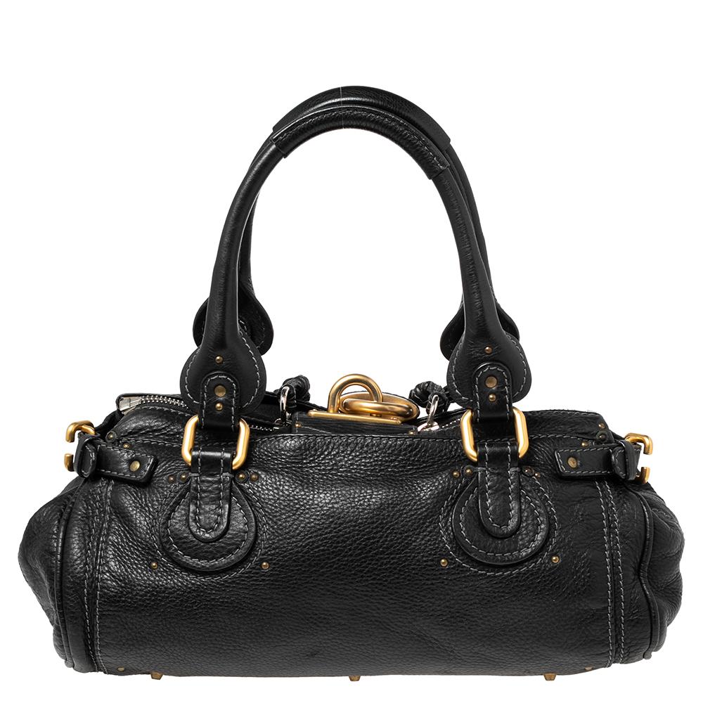 This Paddington satchel from Chloe is designed to offer total essentiality and style at the same time. This satchel is created using leather on the exterior and decorated with gold-toned accents. Its slouchy shape is held by dual top handles. This