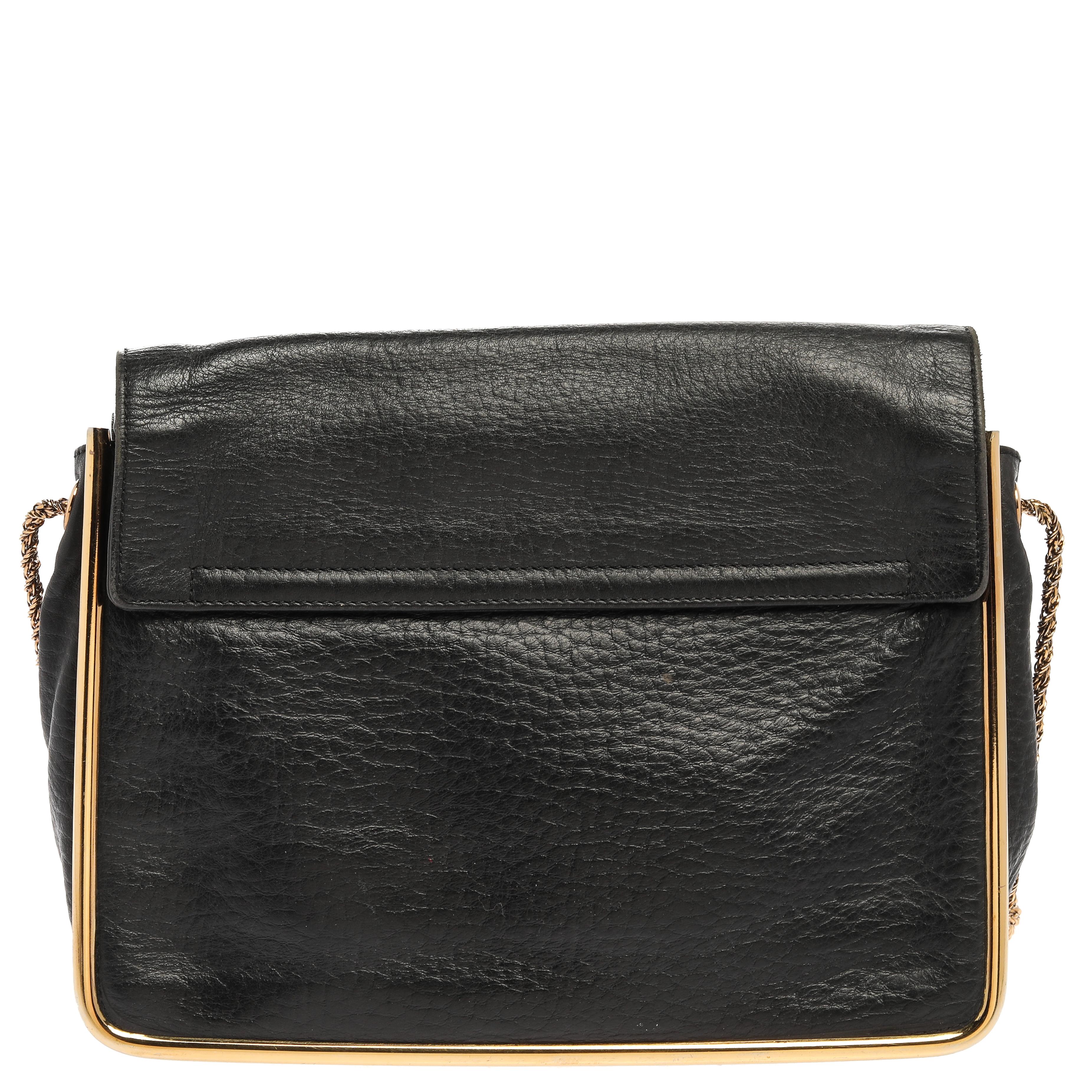 This stylish Sally shoulder bag from Chole is crafted from black leather. The bag features a chain-link strap with leather shoulder rest and a stunning flip-lock in gold-tone. The flap opens to a spacious fabric-lined interior that houses a zip