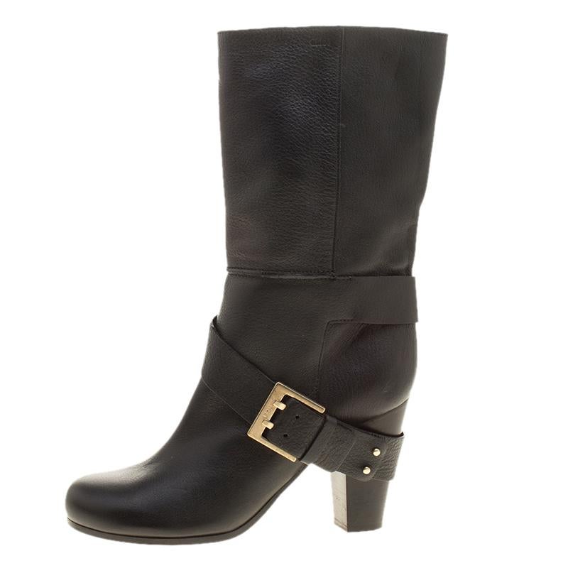 Put some style on with this pair of boots from Chloe! Beautifully crafted from leather, these boots carry a mid-calf length, round toes, buckle detailing, and beautifully sculpted 9 cm heels. Walk around town with this lovely pair!

