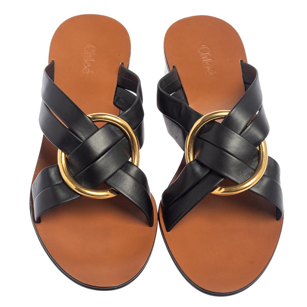Chloé brings you these chic and sophisticated Rony sandals that are not only stylish but highly comfortable. Crafted from black leather, they are adorned with gold-tone circular hardware adorning the vamps. Wear these sandals to casual outings or