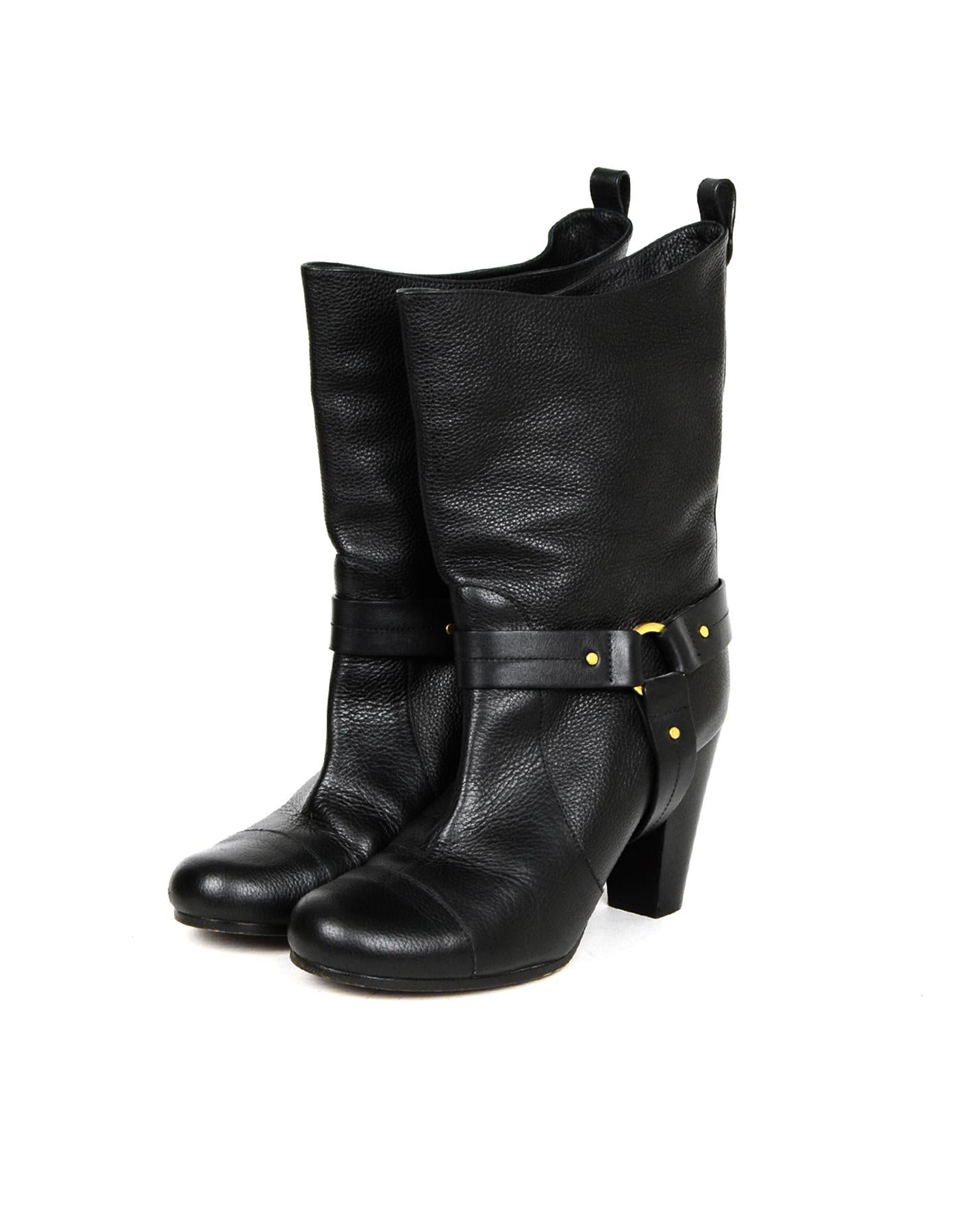 Chloe Black Leather Short Boots sz 40

Made In: Italy
Color: Black
Hardware: Goldtone
Materials: Leather
Closure/Opening: Slip on
Overall Condition: Excellent pre-owned condition, with the exception of minor scuffs on heels and exterior, and wear on