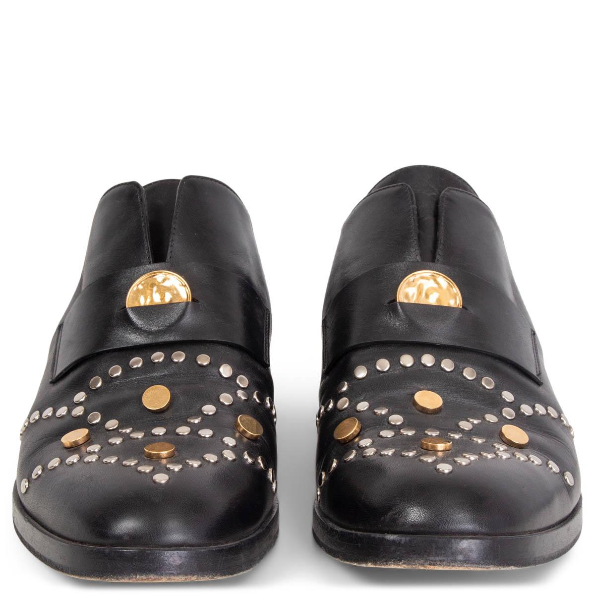 100% authentic Chloé Glory penny loafers in black smooth leather embellished at vamp with gold and silver tone studs and elastic inserts on the side. Have been worn and show some creasing at vamp. Overall in very good condition. Come with dust bags.