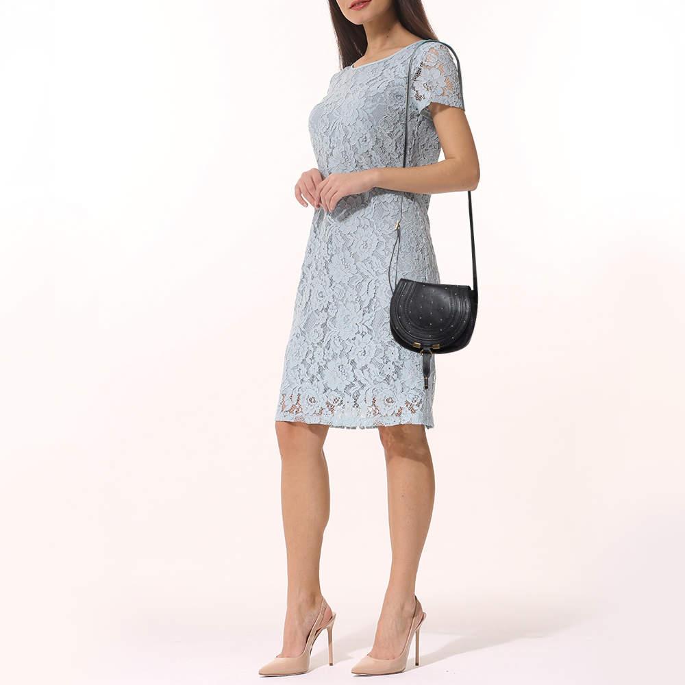 Stunning to look at and durable enough to accompany you wherever you go  this Marcie bag by Chloe is a joy to own This crossbody bag is crafted from leather with a well designed front flap and a shoulder strap. The exterior features a studded design