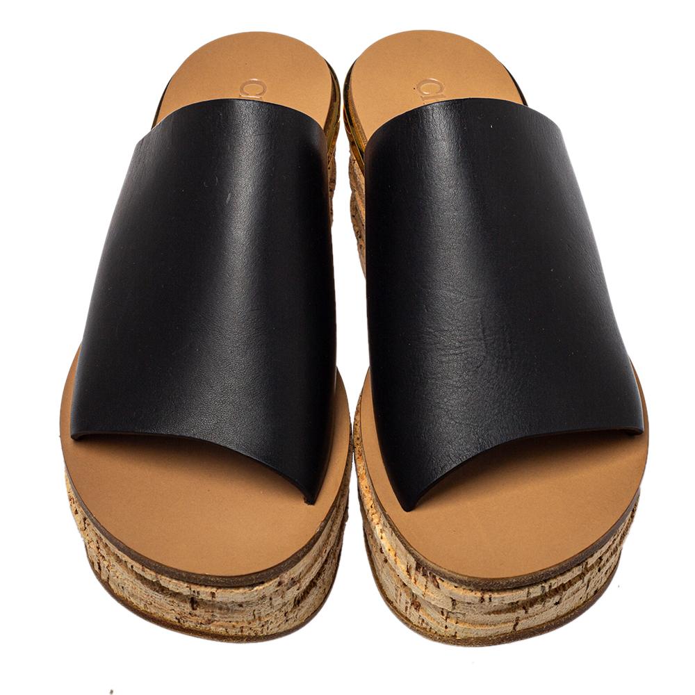 The chunky design of these Chloé sandals will assist you in creating a statement look. They are designed with broad straps of leather and are mounted on thick soles and wedge heels.

Includes: Original Box, Original Dustbag
