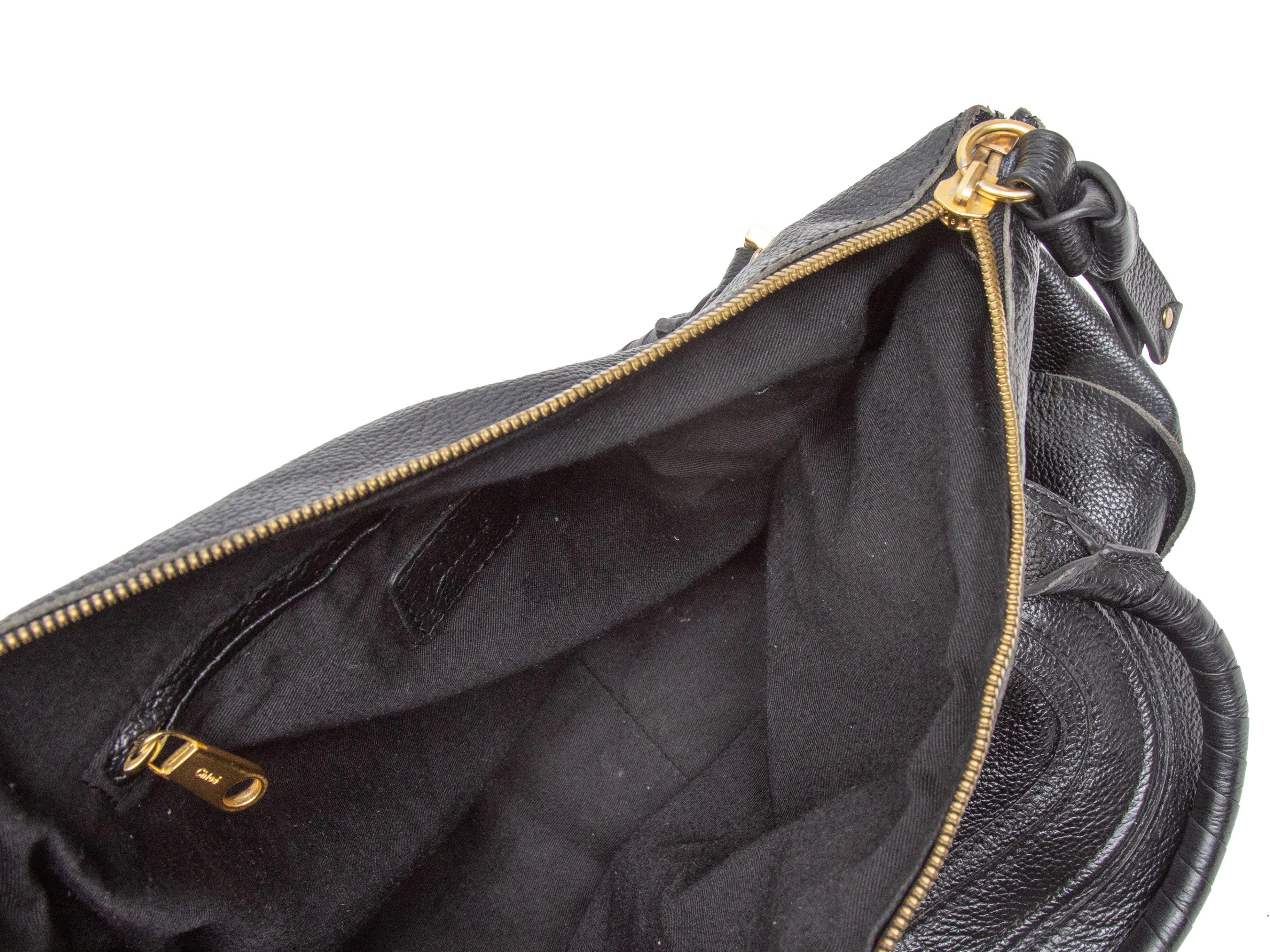 Product Details: Black Chloe Marcie Leather Shoulder Bag. The Marcie Bag features a leather body, gold-tone hardware, dual top handles, a front flap pocket, and a top zip closure. 17