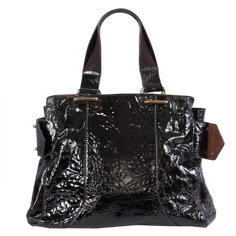 Chloe 'Paddy Gm' in black patent leather with dark brown suede handles. Lined in black cotton with an open and a zipper pocket against the back. Has been carried and is in excellent condition.

Height 29cm (11.3in)
Width 36cm (14in)
Depth 21cm
