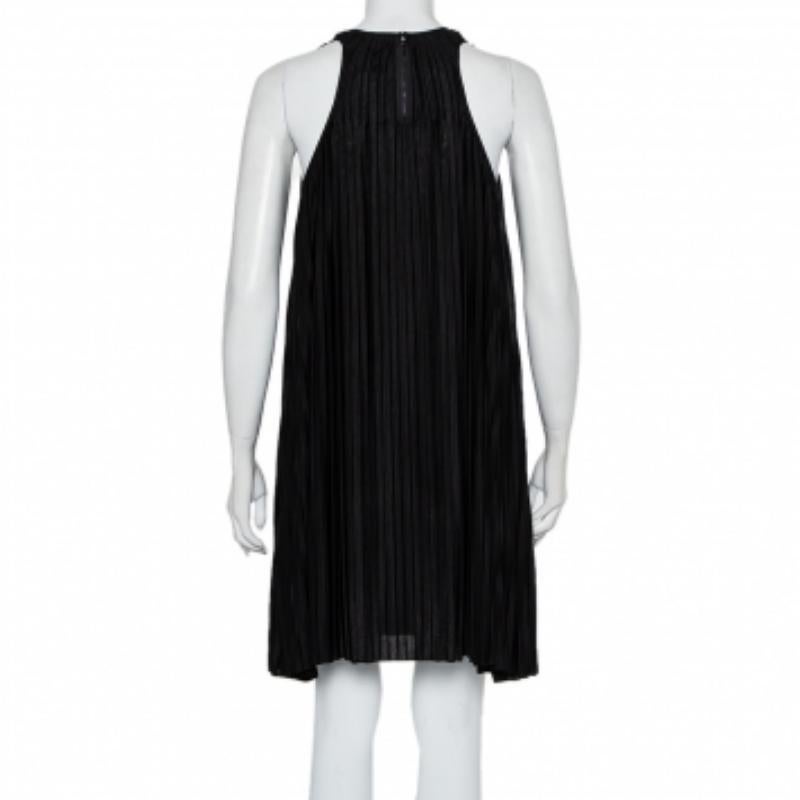This dress is a flawless example of Chloe's ingenious design put together with up-to-date fashion trends. Match your accessories with this elegant black dress and look your stylish best. This dress is masterfully fashioned from pleated silk and