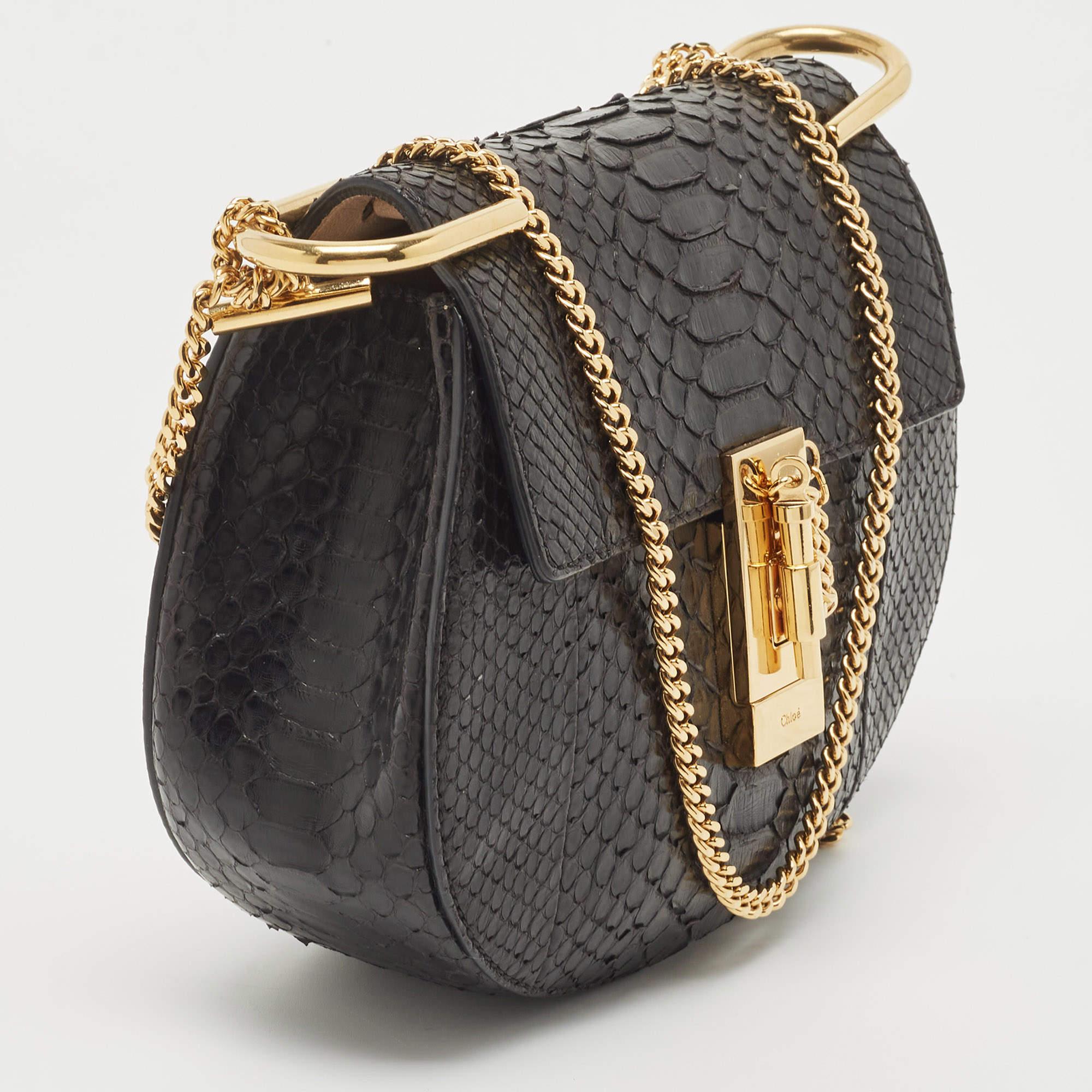 One of the most recognizable bags in the luxury world, Chloe's Drew bag is known for its distinct shape and minimal style detailing. This shoulder bag has been meticulously crafted from exotic skin and designed with a pin lock closure and a shoulder