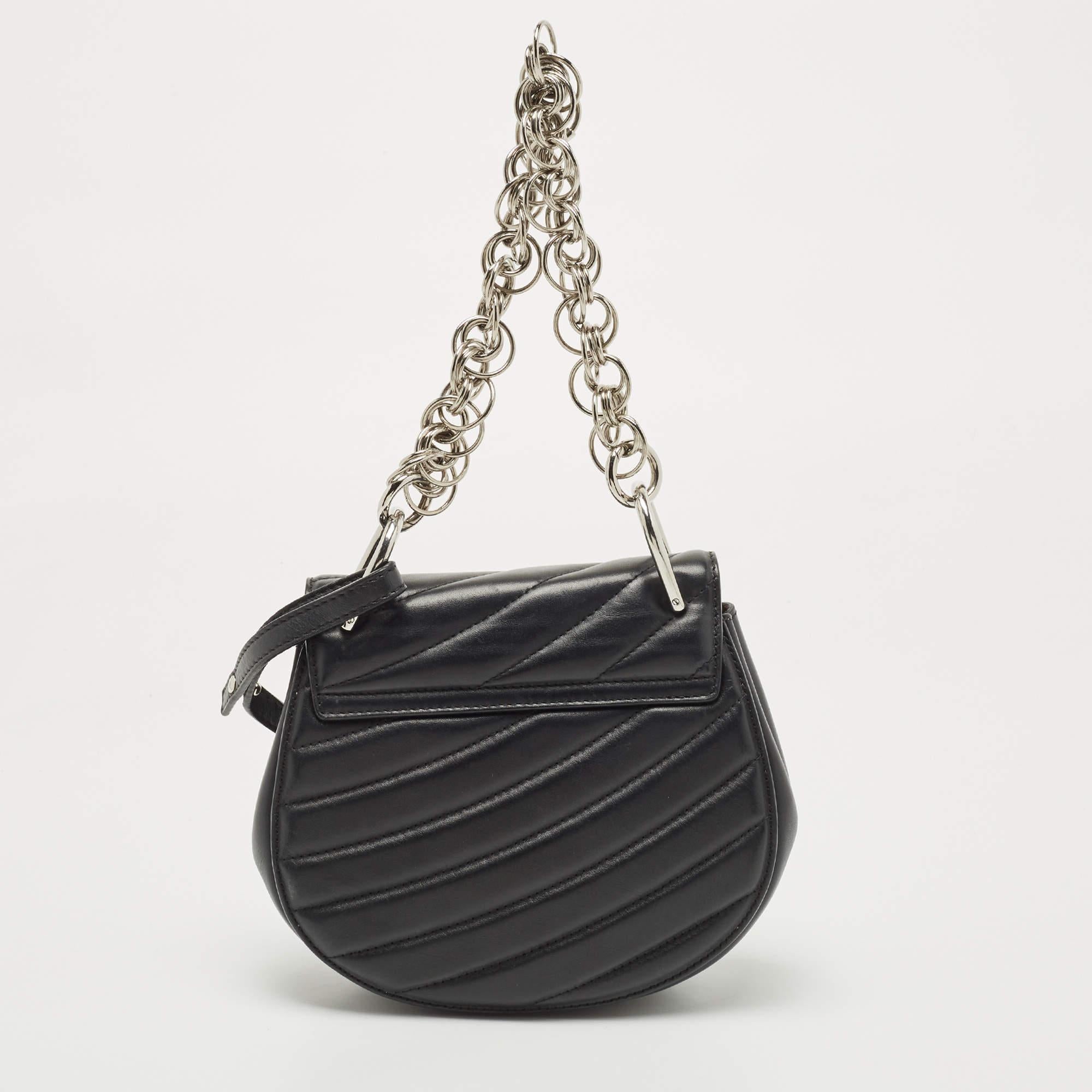 For a look that is complete with style, taste, and a touch of luxe, this designer bag is the perfect addition. Flaunt this beauty on your shoulder and revel in the taste of luxury it leaves you with.

Includes Detachable Strap