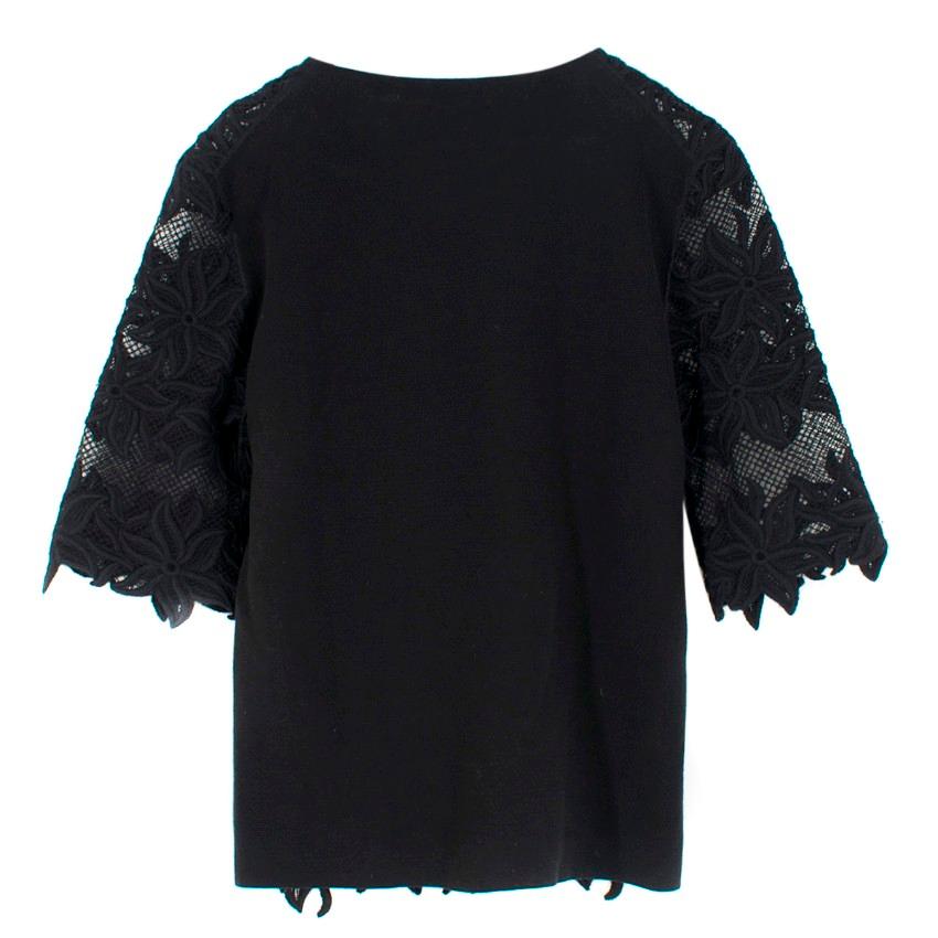 Chloe Black Round-Neck Floral-Lace Top.

- 3/4 length-sleeves
- floral lace print embroidery with sheer panels at the front
- Knit-blend
- Crew neck 

Please note, these items are pre-owned and may show some signs of storage, even when unworn and
