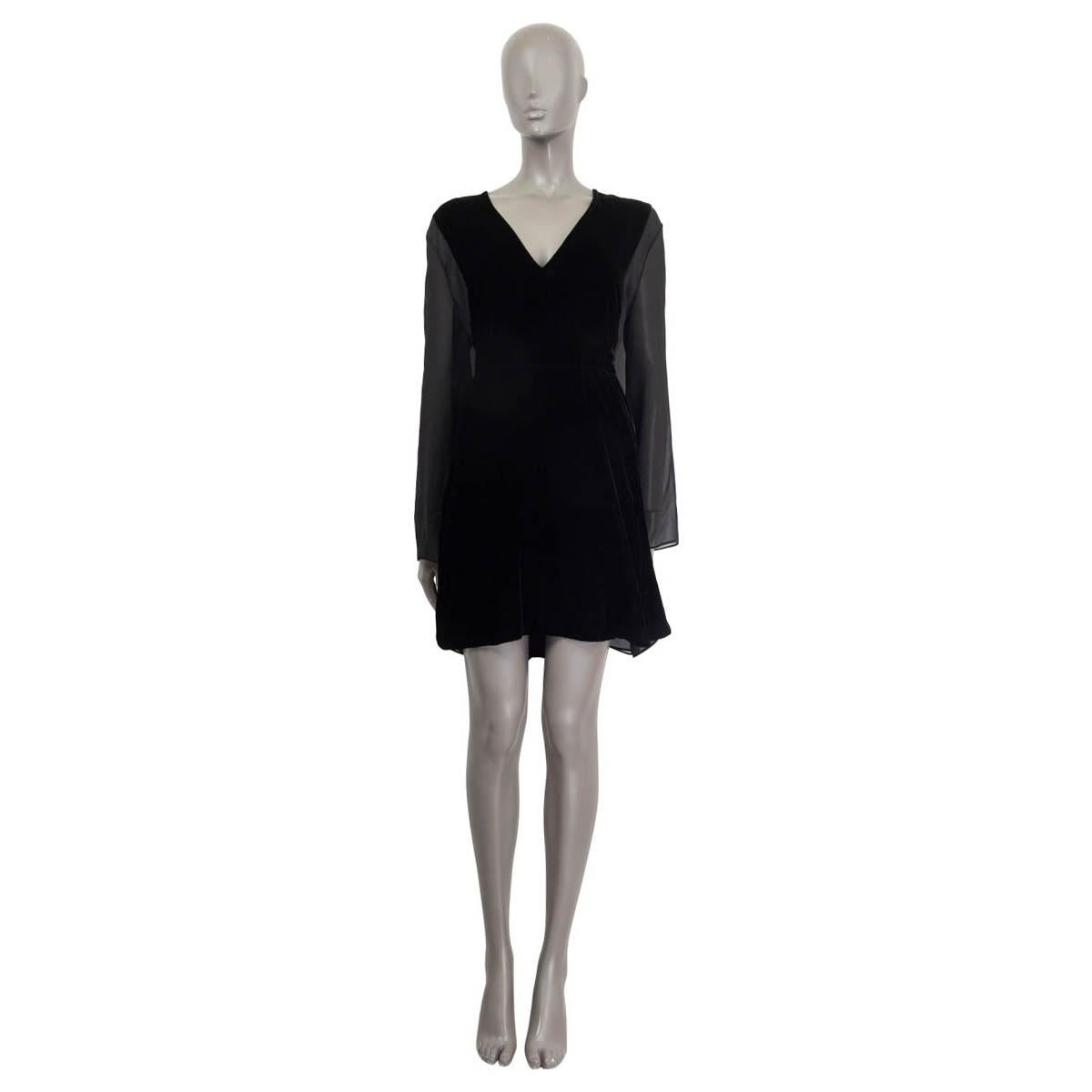 100% authentic Chloé long sleeve dress in black viscose (70%) and cupro (30%). Embellished sheer panels on the sides and sheer sleeves. Opens with three three strings on the front. Lined in black polyester (100%). Has a small hole on the right