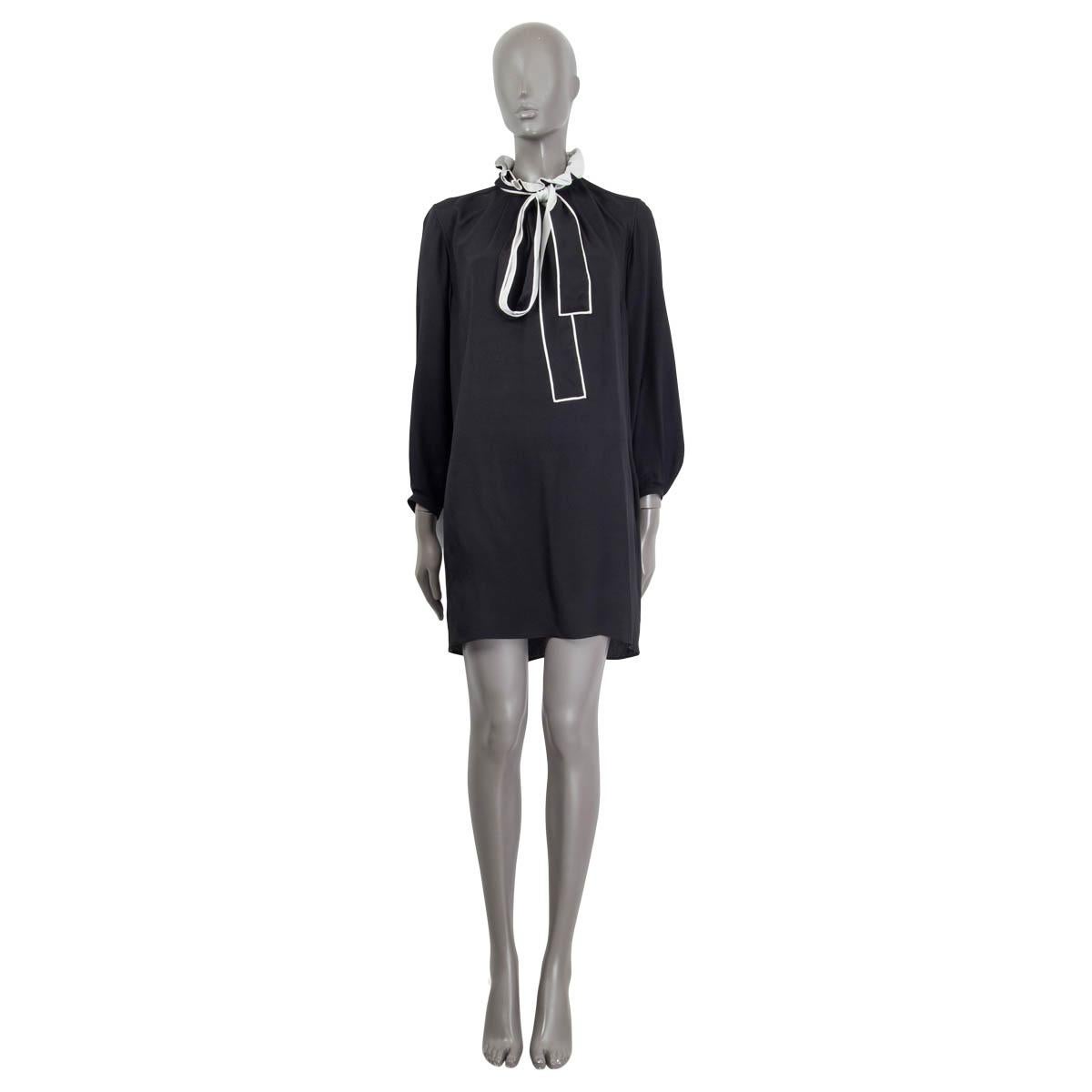 100% authentic Chloé long sleeve dress in black and white acetate (55%) and silk (45%). Features buttoned cuffs, two slit pockets and a self-tie bow. Opens with a concealed zipper at the back. Unlined. Has been worn and is in excellent
