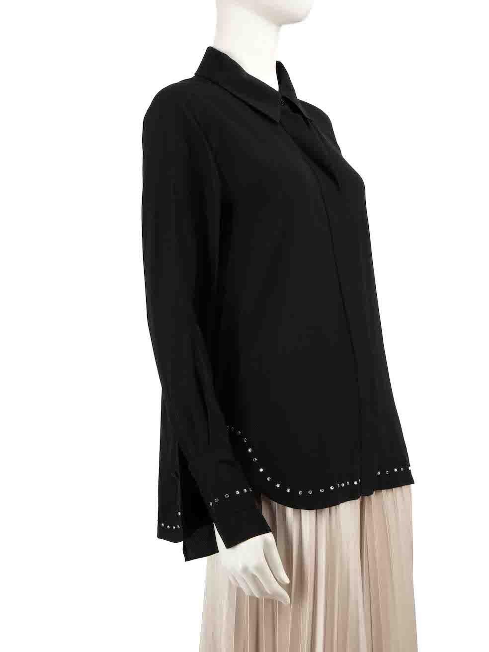 CONDITION is Never worn, with tags. No visible wear to shirt is evident on this new Chloé designer resale item.
 
Details
Black
Silk
Long sleeves blouse
Front button up closure
Crystal embellished detail on hemline
Buttoned cuffs
 
Made in Slovakia
