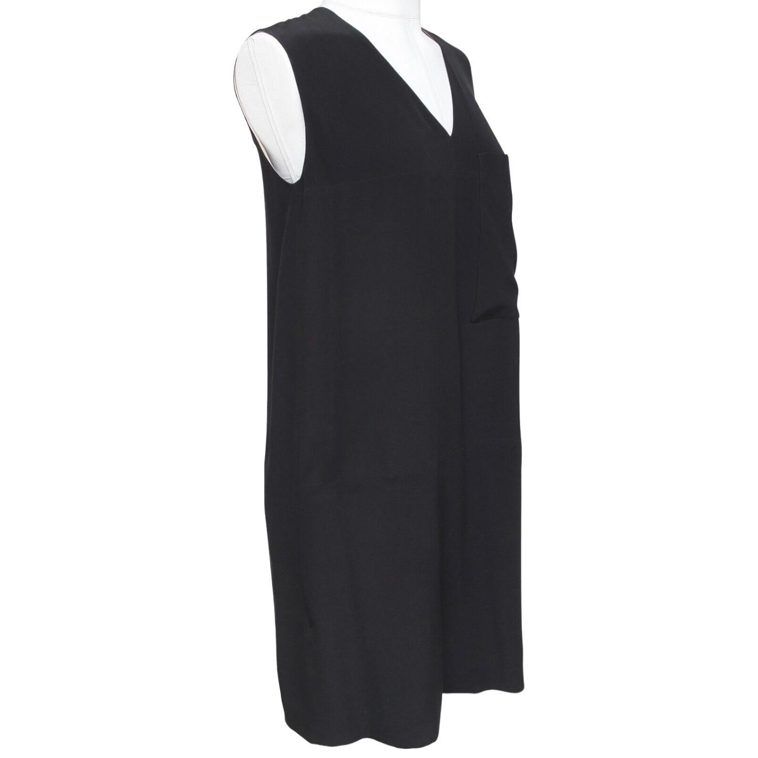 GUARANTEED AUTHENTIC CHLOE BLACK SLEEVELESS SILK DRESS

Design:
- Black silk sleeveless dress.
- V-neck.
- Patch pocket at chest.
- Pockets at hips.
- Rear has pleating.
- Beige color lining.

Size: 34

Material: 100% Silk; Lining 100%
