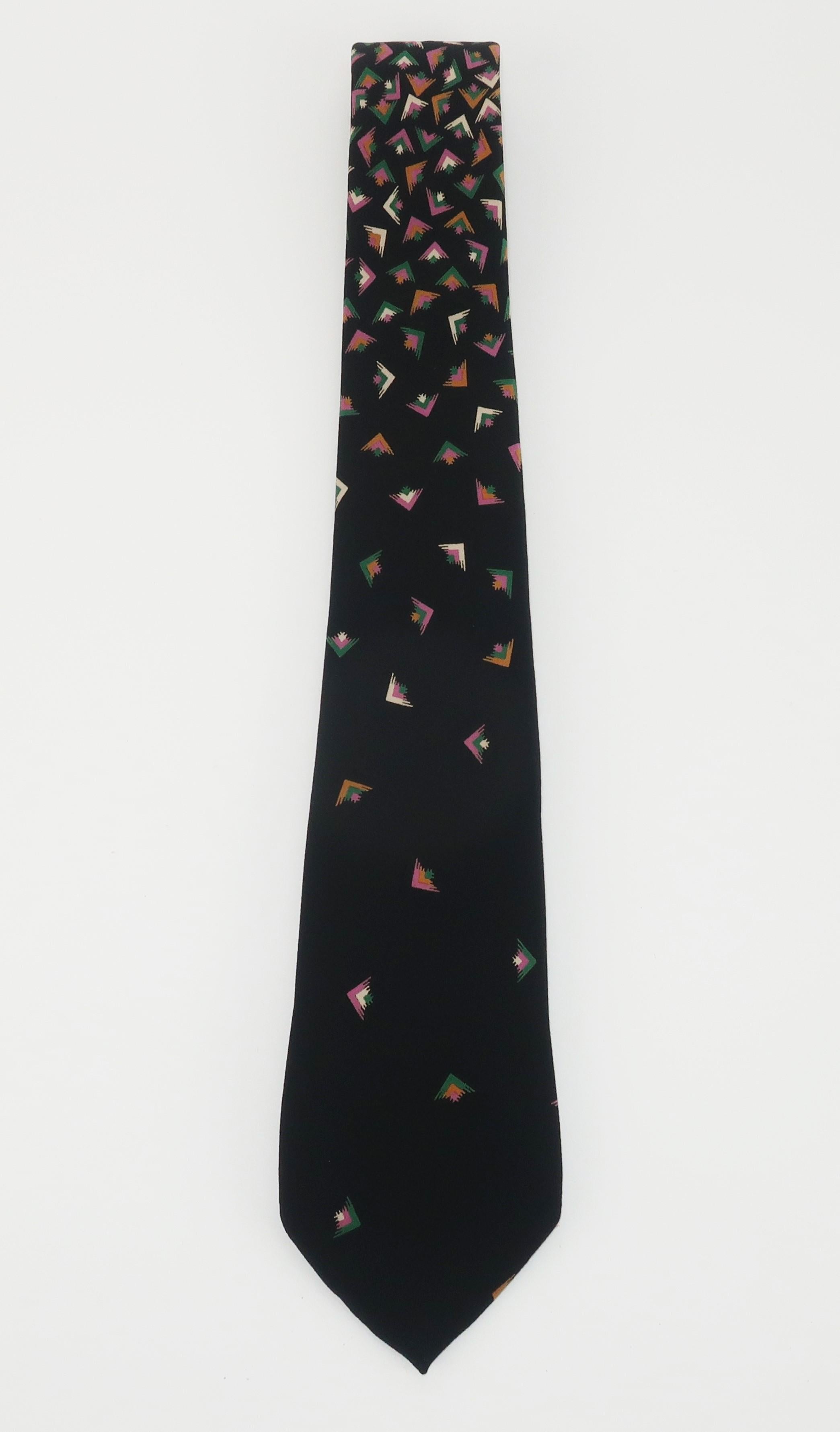 Chloe back silk men's neck tie with a geometric confetti style print in shades of orchid, green, white and cognac.  Originally retailed at I. Magnin.  Hand made in Spain.
CONDITION
Very good condition.  Professionally cleaned and ready for