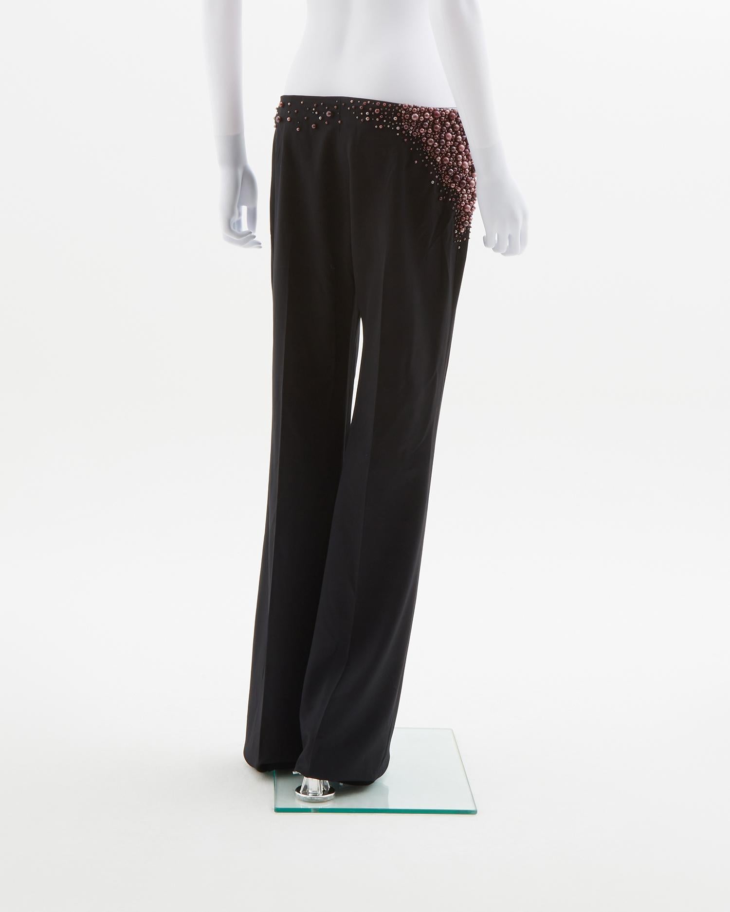 - Chloè designed by Stella McCartney 
- Sold by Skof.Archive
- Fall Winter 2001
- Long wide leg 
- Heavily embellished at right hip
- Purple metallic ball shaped appliques on hip with others scattered throughout waistband 
- Lightweight wool blend