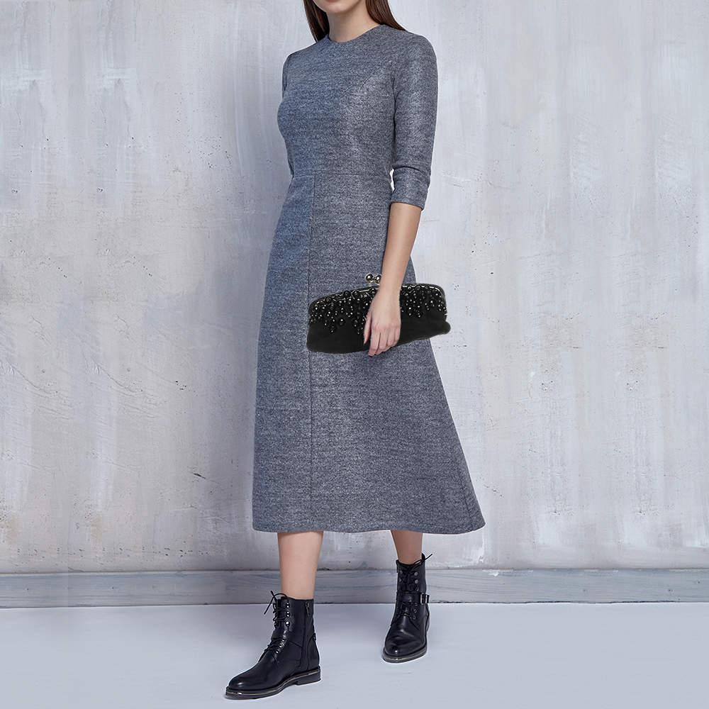 This clutch is just the right accessory to compliment your chic ensemble. It comes crafted in quality material featuring a well sized interior that can comfortably hold all your little essentials.