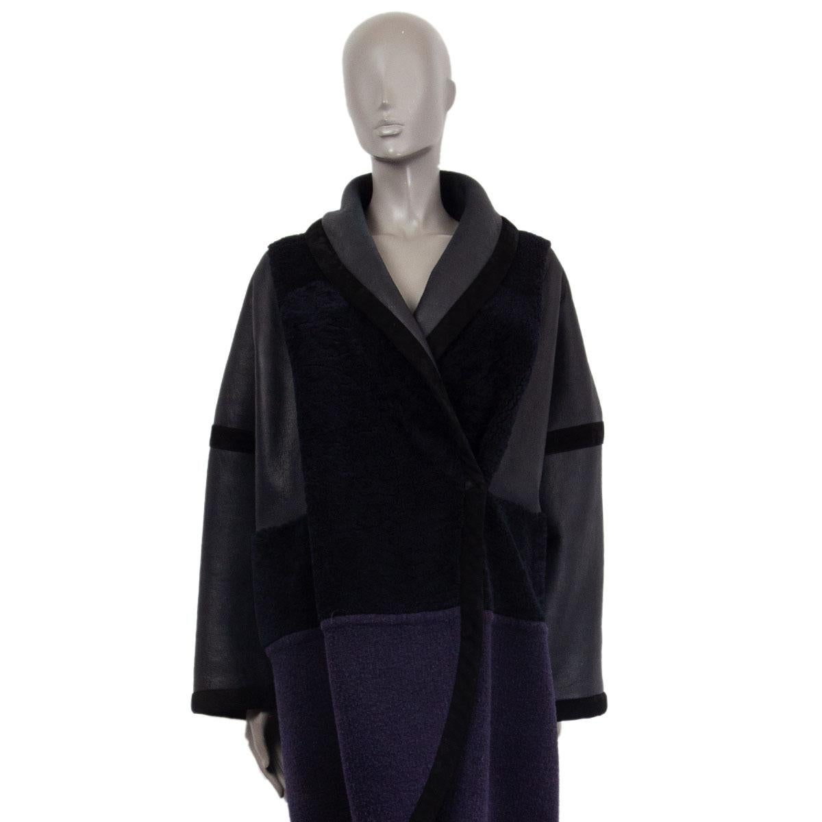 Chloé oversized coat in dark navy and black lambskin (100%), alpaca (55%), virgin wool (30%) and nylon (15%). Closes with one button. Unlined. Has been worn and is in excellent condition. 

Tag Size 40 
Size M
Bust 138cm (53.8in)
Waist 138cm