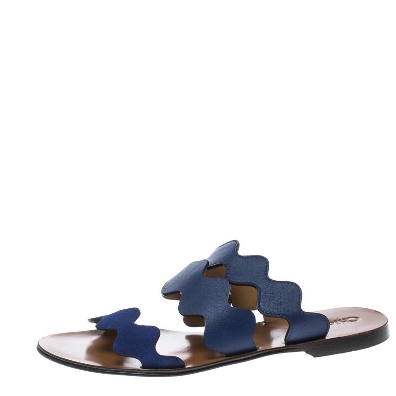 These slides from Chloe are trendy and easy to slip on. They've been designed with three wavy straps in blue and leather insoles. This is one pair that speaks fashion in a simple way.

Includes: Packaging

Size: 37
