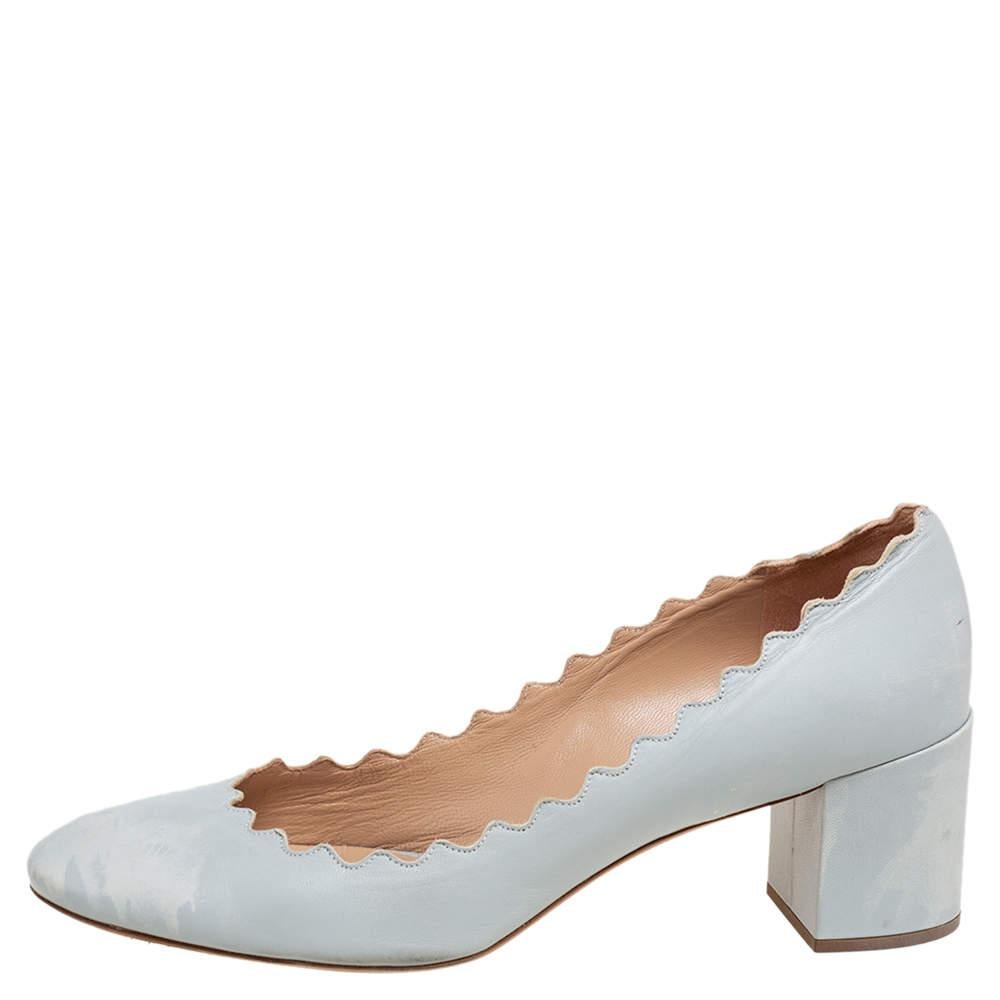 Be summer ready with these pastel blue pumps designed by Chloe. Made using leather, they have a lovely, feminine scallop trim and are complete with block heels and comfortable soles. Pair the simple shoes with flowy dresses and skirts for a