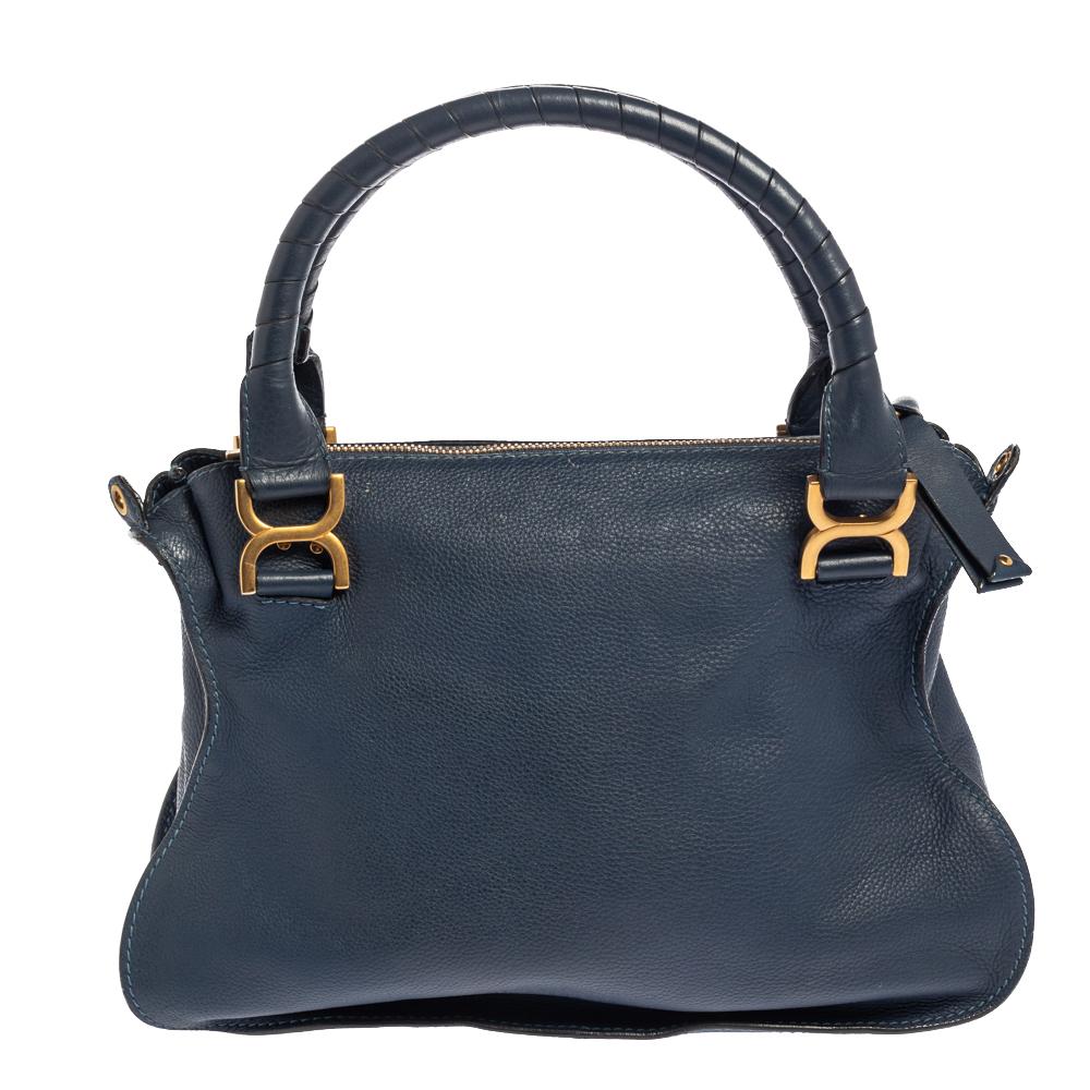 Stunning to look at and durable enough to accompany you wherever you go, this Chloe bag is a joy to own! This Marcie bag is crafted from leather with a well-designed and artistically stitched front flap and a detachable shoulder strap. The insides