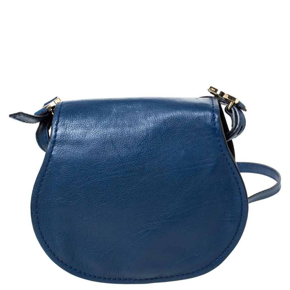 Stunning to look at and durable enough to accompany you wherever you go, this Chloe bag is a joy to own! This Marcie bag is crafted from leather with a well-designed front flap and a shoulder strap. The insides are perfectly sized to carry your