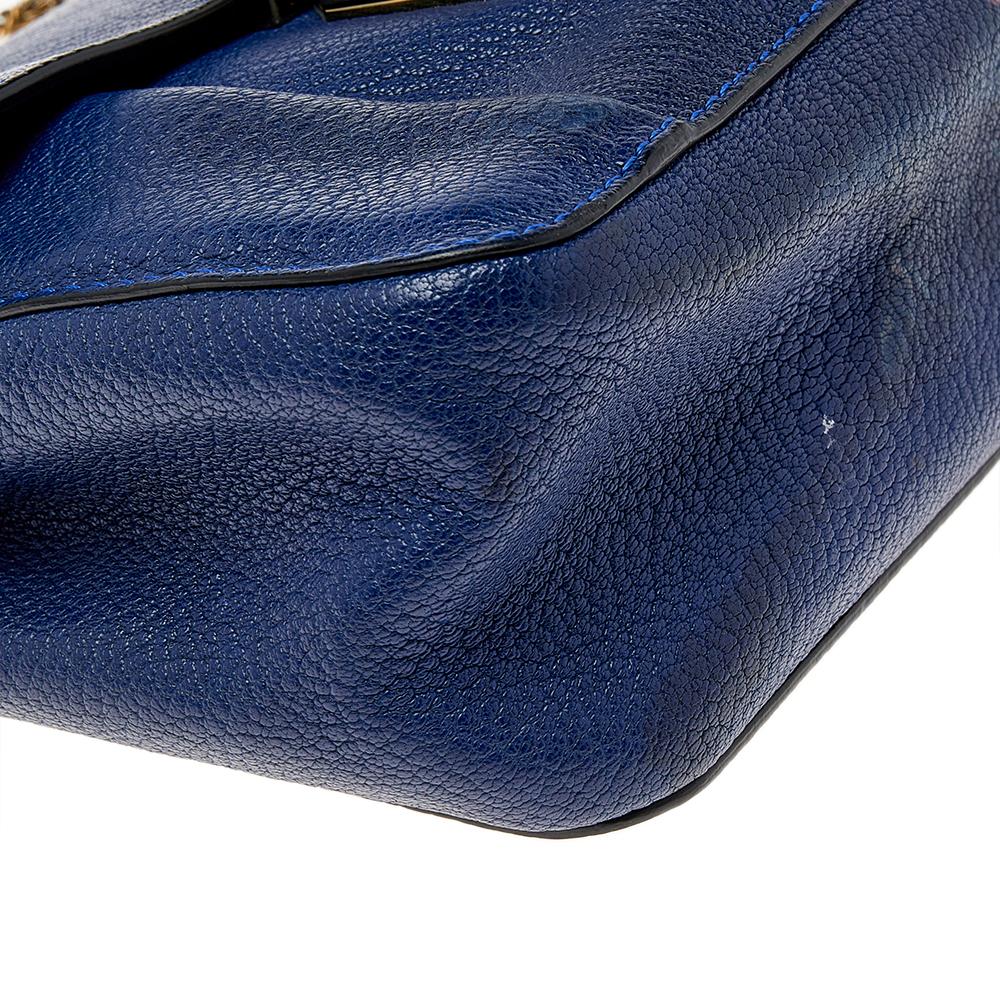 Every curve and detail on this Chloe Elsie is grand which adds to the worth of the bag. It has been crafted from quality leather and styled with a flap. The bag is secured by a turn-lock revealing a well-sized interior and completed with a shoulder