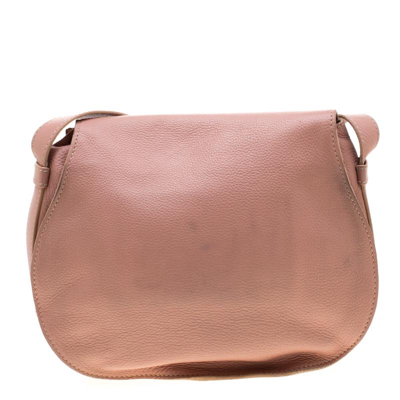 Stunning to look at and durable enough to accompany you wherever you go, this Chloe bag is a joy to own! This Marcie bag is crafted from leather with a well-designed front flap and a shoulder strap. The insides are fabric lined and perfectly sized